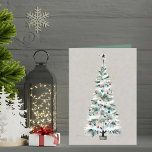 Simple Elegant Christmas Tree Custom Text Holiday Card<br><div class="desc">This elegant Christmas card features a minimalist design, perfect for those who appreciate simplicity and sophistication. The front of the card showcases a beautifully illustrated Christmas tree adorned with colourful ornaments in shades of red, blue, and gold. Delicate white snow gently graces the tree branches, adding a touch of winter...</div>
