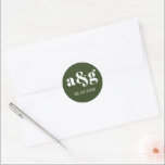 Simple, elegant monogram dark green wedding classic round sticker<br><div class="desc">Simple,  elegant monogram dark green wedding sticker. It displays your initial and the date of your wedding in white on dark green background. It coordinates with our "Vintage oleander" collection.</div>