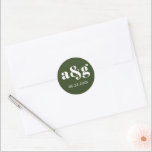 Simple, elegant monogram dark green wedding classic round sticker<br><div class="desc">Simple,  elegant monogram dark green wedding sticker. It displays your initial and the date of your wedding in white on dark green background. It coordinates with our "Vintage oleander" collection.</div>
