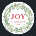 Simple Elegant Wreath Joy Modern Christmas Classic Round Sticker<br><div class="desc">Elegant Christmas sticker featuring "JOY" along with your family name and year in red surrounded by a greenery wreath.  These holiday stickers make great envelope seals for your Christmas cards or as gift tags.</div>
