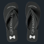 Simple Fun Groomsman Name & Bow Tie Wedding Jandals<br><div class="desc">These fun flip flops are a great way to thank the groomsmen at your wedding, and a wonderful way to give his feet a break after a long day! They feature a simple white on black design with his name at the top, the word "Groomsman" spelled out in classy letters...</div>