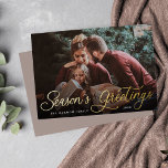 Simple Gold Script Overlay Seasons Greetings Photo<br><div class="desc">Elegant Christmas photo card features a single horizontal or landscape-orientated photo with "Season's Greetings" overlaid in gold foil calligraphy script lettering. Personalise with your family name or individual names and the year beneath in modern white lettering. A simple and chic choice for your holiday greetings.</div>