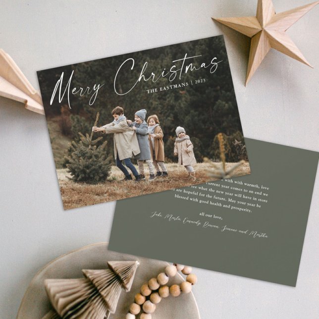 Simple Handwritten Script Photo Christmas Holiday Card (A simple photo christmas holiday card with handwritten Merry Christmas script typographic overlay.)