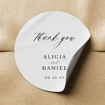 Simple minimalist elegant wedding favour classic round sticker<br><div class="desc">Elegant simple minimal black and white wedding favour thank you sticker featuring a classy stylish chic trendy calligraphy script. Easy to personalise with your details! Suitable for formal black tie neutral weddings. Please note that the background colour can be changed to match your wedding colour scheme. If comfortable doing it,...</div>