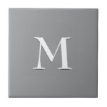 Simple Modern Grey White Monogram Tile<br><div class="desc">Simple,  elegant SILVER GRAY ceramic tile with optional,  customisable monogram. Designed to coordinate with music notes version. Delete monogram for plain tile. Available in other colours and with matching items. Ideal for bathroom decor or kitchen decor updates.</div>