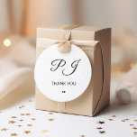 Simple monogram initials thank you wedding classic round sticker<br><div class="desc">Black and white simple minimal classic formal romantic calligraphy traditional style monogram name initials wedding thank you sticker template with two little hearts.             Easy to personalise with bride and groom couple monogram.</div>