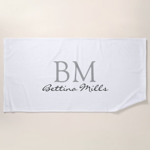 simple monogram on white beach towel