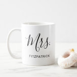Simple Mrs Last Name Newlywed Bride Wedding Coffee Mug<br><div class="desc">Simple coffee mug with "Mrs." in an elegant script along with your last name in black over a white background.  This modern coffee mug makes a great wedding gift for a bride.</div>
