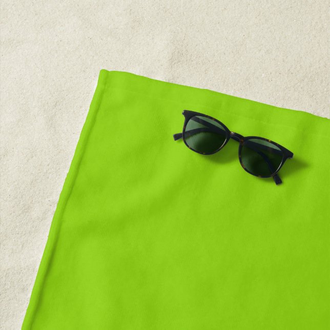 Simple plain solid green beach towel (In Situ)