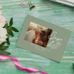 Simple Sage Green Calligraphy Boho Photo Wedding Save The Date<br><div class="desc">A very elegant simple and chic sage green and white script photo wedding save the date. Which features minimal greenery background and white save the date brushstroke typography. With customisable engagement or just casual groom and bride's photo. Grab this stylish wedding save the date and make your invites truly engaged....</div>