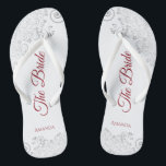 Simple Silver Lace & Red Script The Bride Wedding Jandals<br><div class="desc">Dance the night away with these beautiful wedding flip flops. Designed for the bride, they feature a simple yet elegant design with crimson red script lettering on a white background and fancy silver grey lace curls and swirls. Beautiful way to stay fancy and appropriate while giving your feet a break...</div>