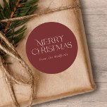 Simple Stylish Merry Christmas | Name | Red Classic Round Sticker<br><div class="desc">These stylish Christmas stickers feature simple,  stylish typography reading,  "Merry Christmas" in ivory. A text template is included for easy personalisation. The background colour (burgundy red) can be customised to any colour you'd like. Great for envelope seals,  gift tag stickers,  party favour stickers,  and more!</div>