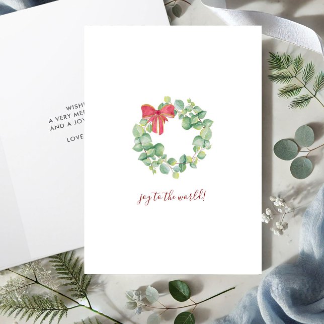 Simple Watercolor Botanical Wreath Christmas Card (Christmas cards watercolor wreath with red bow art by Victoria Grigaliunas Do Tell A Belle)
