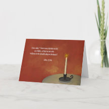 Single candle with a scripture from John 12:46 Car