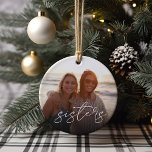 Sisters Overlay Photo Ceramic Tree Decoration<br><div class="desc">Keep a constant reminder of your most important priority nearby with this sweet family keepsake ornament. Add a favourite photo to each side,  with "sisters" overlaid in white casual handwritten script lettering. Makes a heartfelt gift for your sister,  stepsister,  or sorority sister.</div>