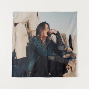 Sitting and smiling woman wearing black pants tapestry