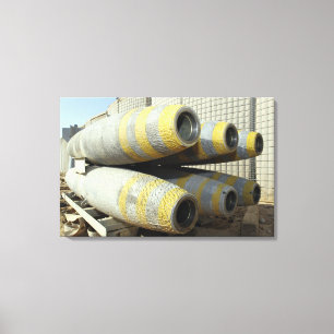 Six GBU-12 bombs sit in a rack Canvas Print