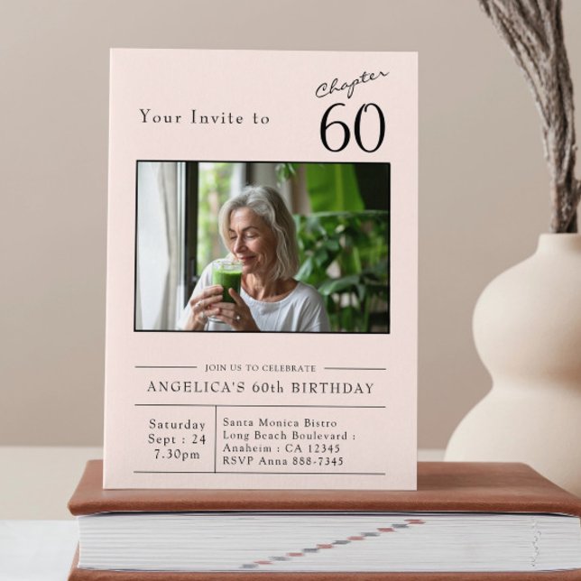Sixty Blush Pink 60th Birthday Party Photo Invitation (60th birthday blush pink party invitation stood on a book.)