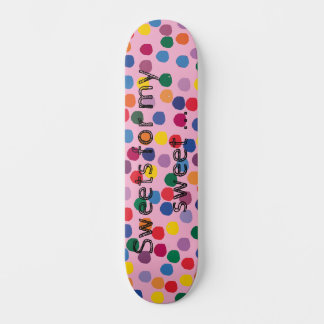 Skateboard with colorful dots and pink background