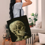 Skeleton with a Burning Cigarette | Van Gogh Tote Bag<br><div class="desc">Skull of a Skeleton with Burning Cigarette (1886) by Dutch post-impressionist artist Vincent Van Gogh. Original painting is an oil on canvas, most likely from Van Gogh's short-lived period of drawing courses at the Academy of Art in Antwerp. The burning cigarette was probably intended as a joke, perhaps as a...</div>