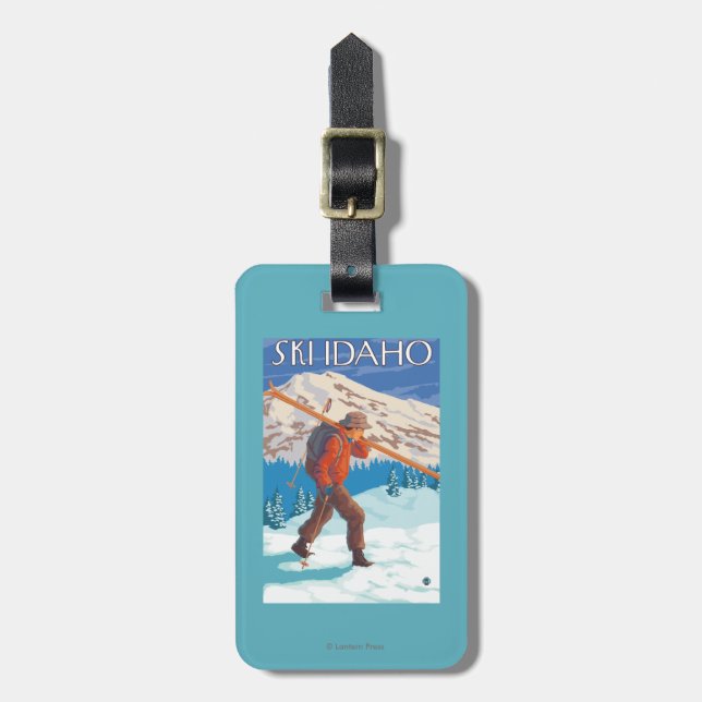Skier Carrying Snow Skis - Idaho Luggage Tag (Front Vertical)