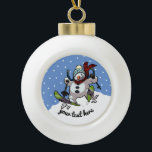 Skiing Snowman In Woolly Christmas Hat Cartoon Ceramic Ball Christmas Ornament<br><div class="desc">A round Christmas tree decoration or bauble,  featuring a cartoon of an over excited snowman with a carrot nose and coal eyes,  dashing through the snow on skis,  in woolly winter hat and tartan scarf. An upbeat image for Xmas. Change the default text to your preferred message or caption.</div>