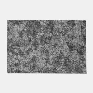 Skinned on a lightly spotted grey and black  doormat