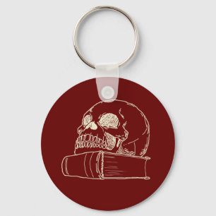 Skull and a book key ring
