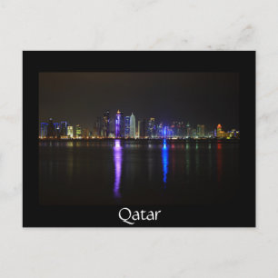 Skyline of Doha, Qatar at night black postcard