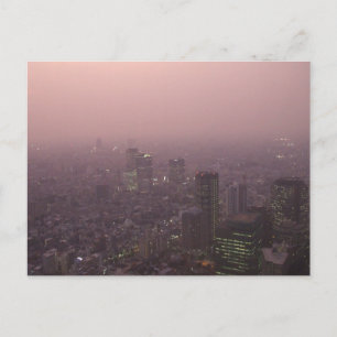 Skyscrapers bathed in a pale pink glow. postcard