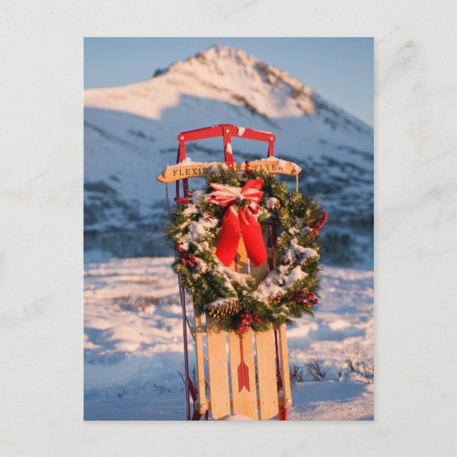 Sled in Snow with Christmas Wreath Holiday Postcard (Front)