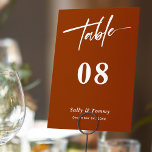 Sleek and Stylish: Terracotta Modern Wedding Table Number<br><div class="desc">"Sleek and Stylish: Terracotta Modern Wedding Table Number" is the perfect choice for couples who want to infuse a contemporary vibe into their wedding reception. These table numbers feature clean lines and a minimalist design, creating an elegant and sophisticated look. With this option, your guests will be impressed by the...</div>