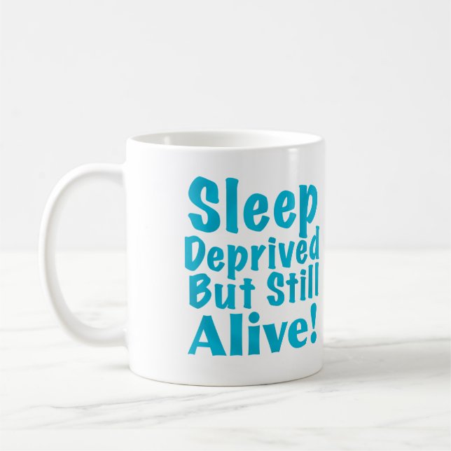 Sleep Deprived But Still Alive in Blue Coffee Mug (Left)