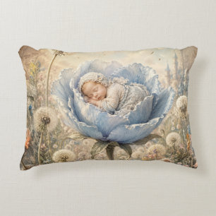 Sleeping baby in blue flower decorative cushion