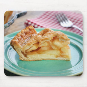 Slice of fresh baked apple pie on plate mouse pad