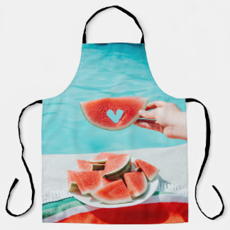 Sliced watermelon on white paper apron