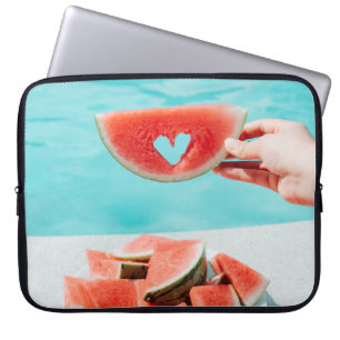 Sliced watermelon on white paper laptop sleeve