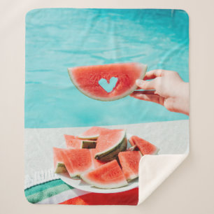 Sliced watermelon on white paper sherpa blanket