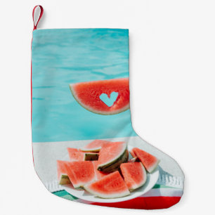 Sliced watermelon on white paper small christmas stocking