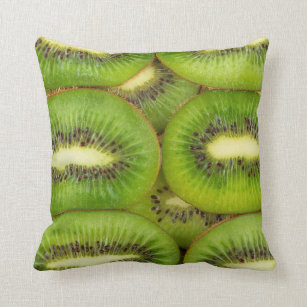 Slices of fresh and ripe kiwi fruit in rowsbrown,c cushion