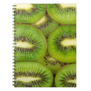 Slices of fresh and ripe kiwi fruit in rowsbrown,c notebook