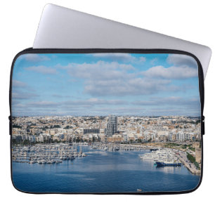 Sliema harbour with modern buildings and boats laptop sleeve