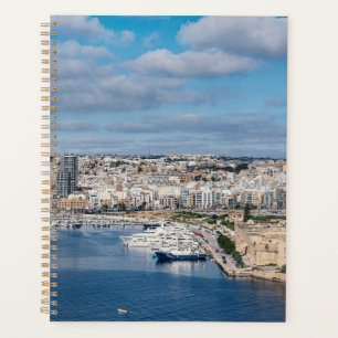 Sliema harbour with modern buildings and boats planner