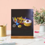 SlipperyJoe Hanukkah symbolic still life holiday e Acrylic Sign<br><div class="desc">SlipperyJoe Hanukkah symbolic still life holiday essence vibrant meaningful objects colourful slender pile menorah candles artistic red blue yellow and white sufganiyah doughnut classic jelly-filled commemorate miracle of the oil dreidels metallic gold glossy blue Hebrew great miracle happened there metallic pewter star of David medallion light resilience community themes spiritual...</div>
