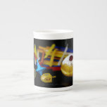 SlipperyJoe Hanukkah symbolic still life holiday e Bone China Mug<br><div class="desc">SlipperyJoe Hanukkah symbolic still life holiday essence vibrant meaningful objects colourful slender pile menorah candles artistic red blue yellow and white sufganiyah doughnut classic jelly-filled commemorate miracle of the oil dreidels metallic gold glossy blue Hebrew great miracle happened there metallic pewter star of David medallion light resilience community themes spiritual...</div>