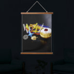 SlipperyJoe Hanukkah symbolic still life holiday e Hanging Tapestry<br><div class="desc">SlipperyJoe Hanukkah symbolic still life holiday essence vibrant meaningful objects colourful slender pile menorah candles artistic red blue yellow and white sufganiyah doughnut classic jelly-filled commemorate miracle of the oil dreidels metallic gold glossy blue Hebrew great miracle happened there metallic pewter star of David medallion light resilience community themes spiritual...</div>