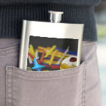 SlipperyJoe Hanukkah symbolic still life holiday e Hip Flask<br><div class="desc">SlipperyJoe Hanukkah symbolic still life holiday essence vibrant meaningful objects colourful slender pile menorah candles artistic red blue yellow and white sufganiyah doughnut classic jelly-filled commemorate miracle of the oil dreidels metallic gold glossy blue Hebrew great miracle happened there metallic pewter star of David medallion light resilience community themes spiritual...</div>