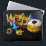 SlipperyJoe Hanukkah symbolic still life holiday e Laptop Sleeve<br><div class="desc">SlipperyJoe Hanukkah symbolic still life holiday essence vibrant meaningful objects colourful slender pile menorah candles artistic red blue yellow and white sufganiyah doughnut classic jelly-filled commemorate miracle of the oil dreidels metallic gold glossy blue Hebrew great miracle happened there metallic pewter star of David medallion light resilience community themes spiritual...</div>