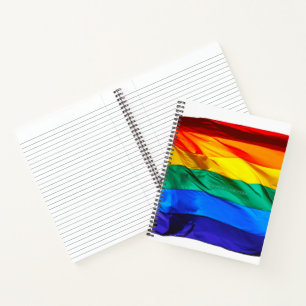 SlipperyJoe's gay pride flag waving pride colours  Notebook