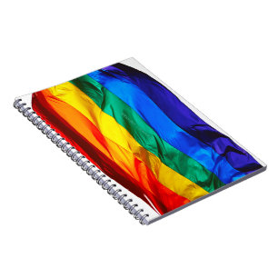 SlipperyJoe's gay pride flag waving pride colours  Notebook